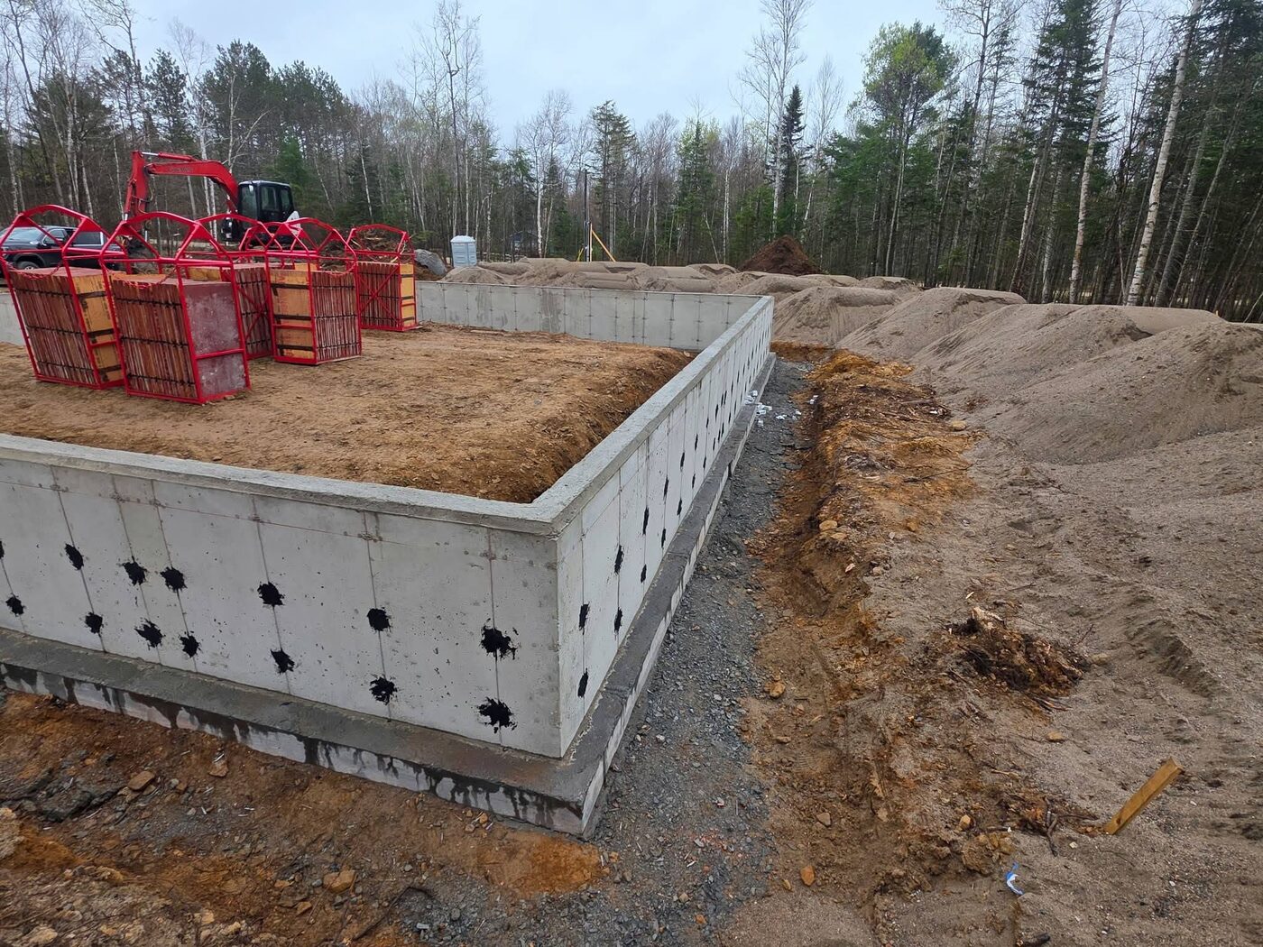 Corner of the foundation walls with form panels stacked on top