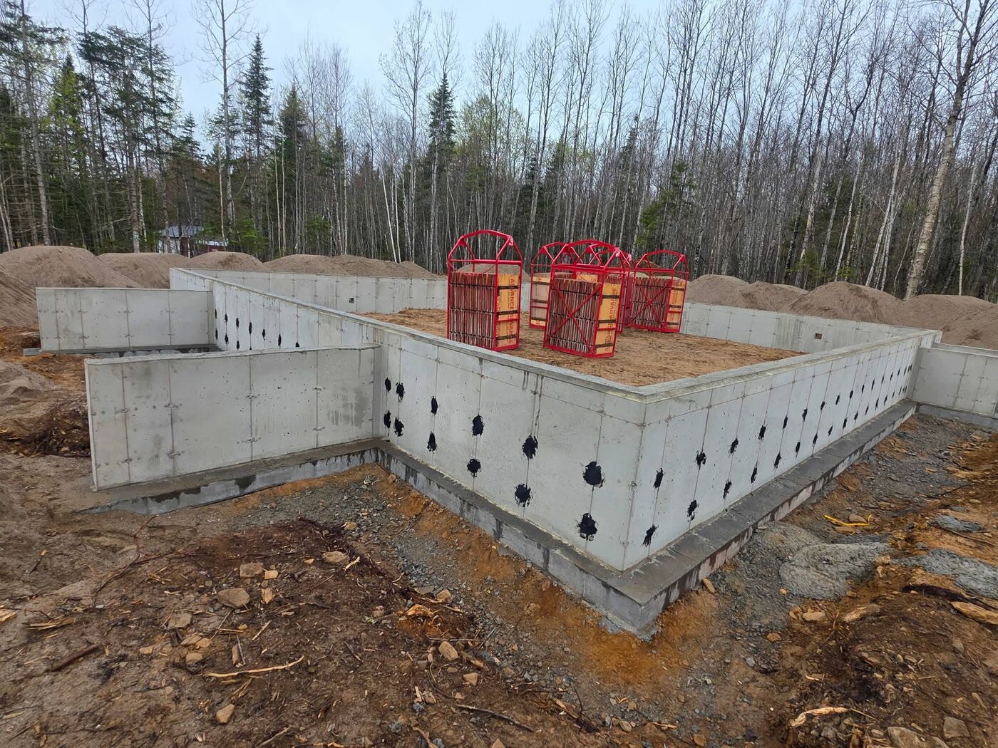 Stripped foundation walls with damp-proofed snap-tie holes