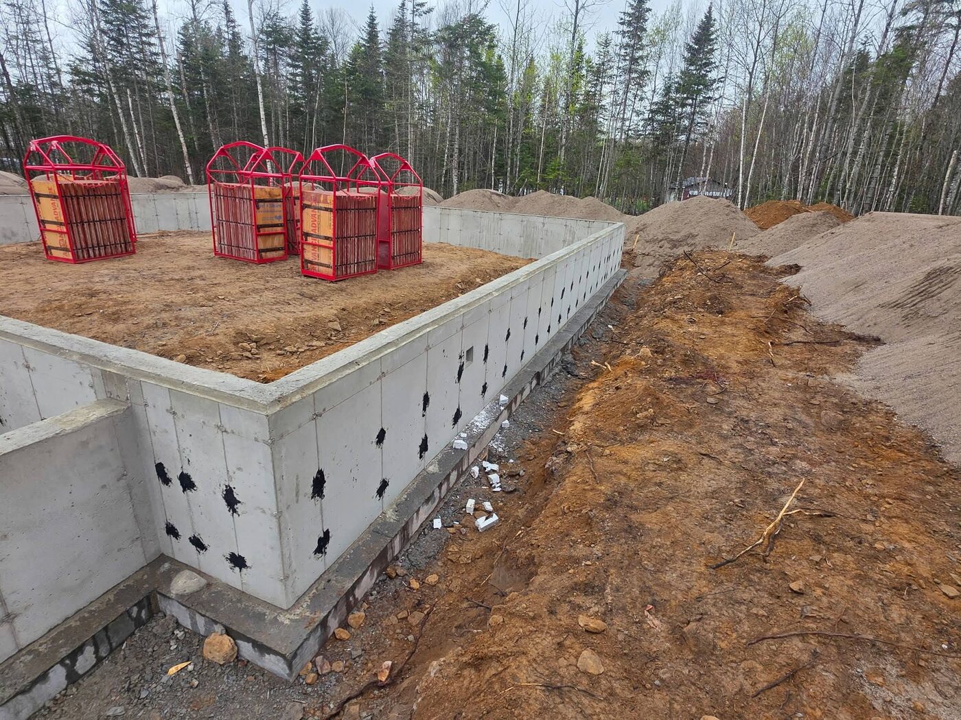 Interior corner of the stripped foundation showing the bearing wall