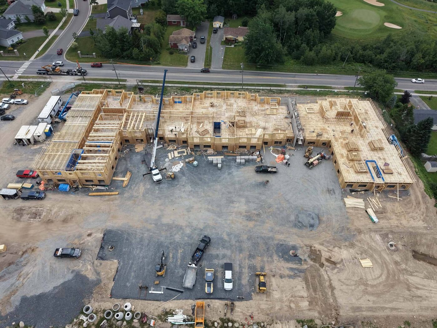 Aerial view of floor decks being framed across the site