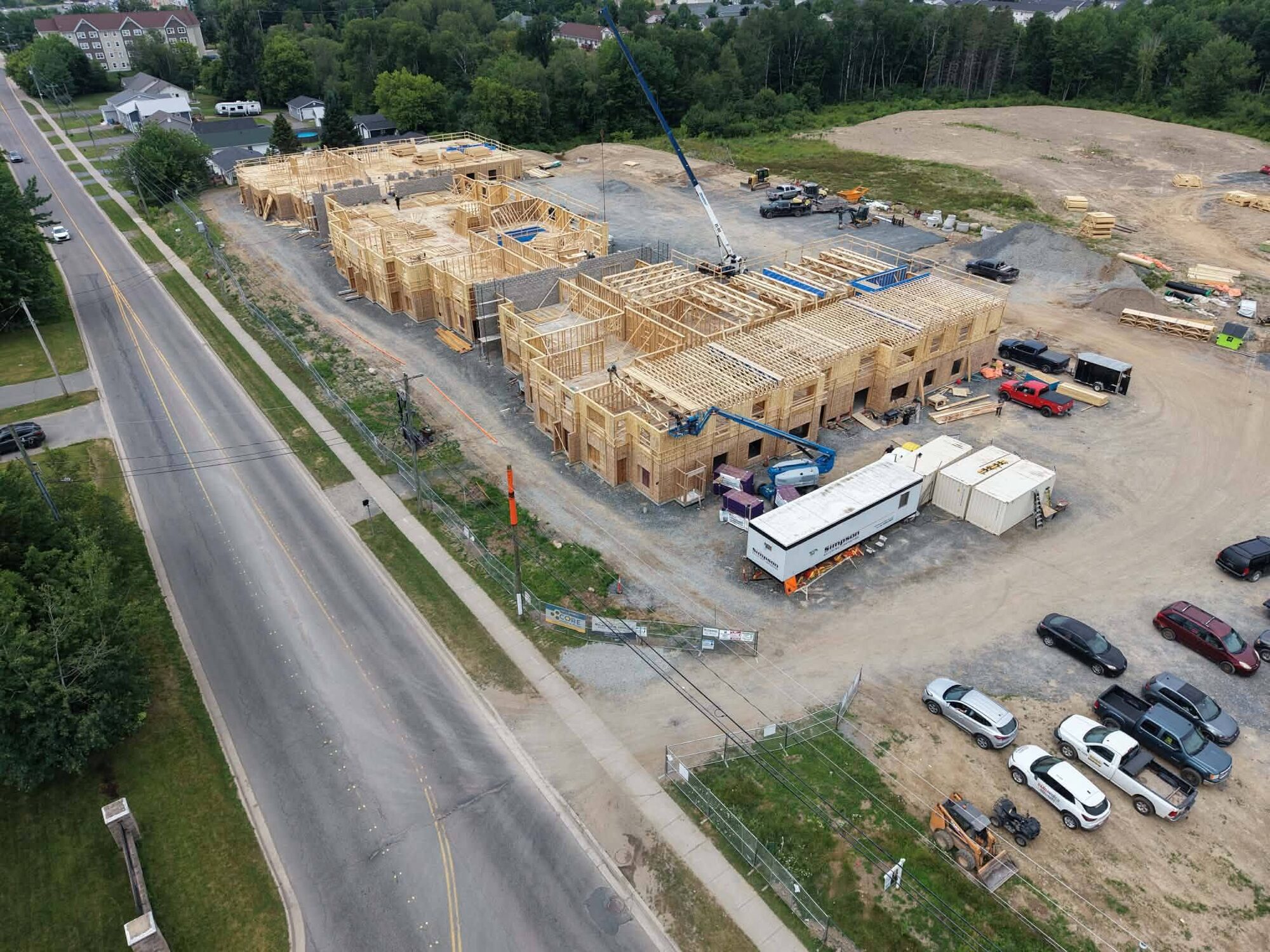 Framing underway across several building sections at 641 Brookside Drive