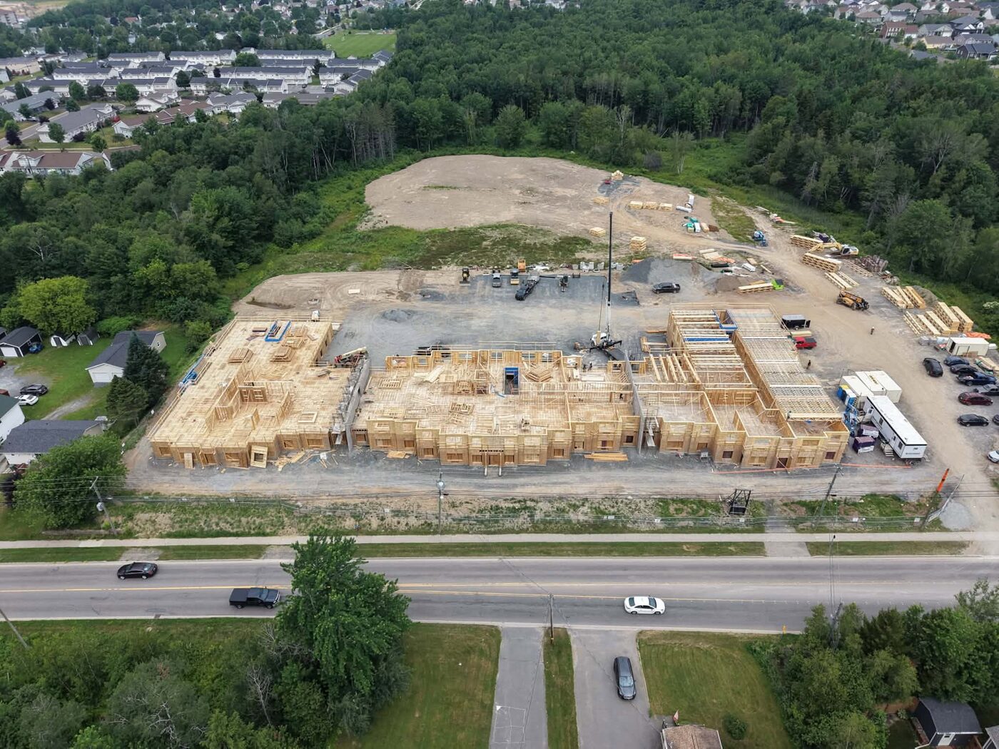High aerial view of the full site with framing in progress