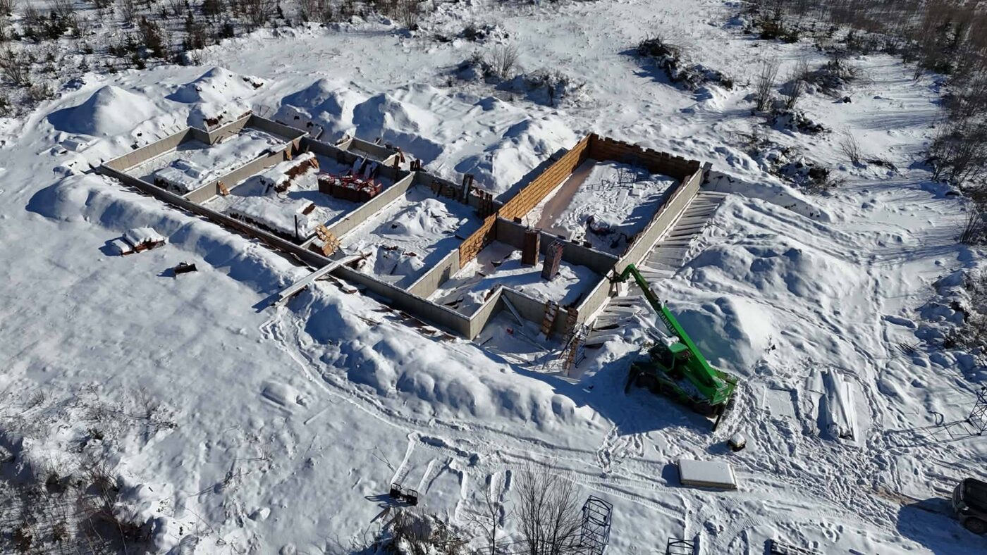Aerial view of the foundation being formed in snow
