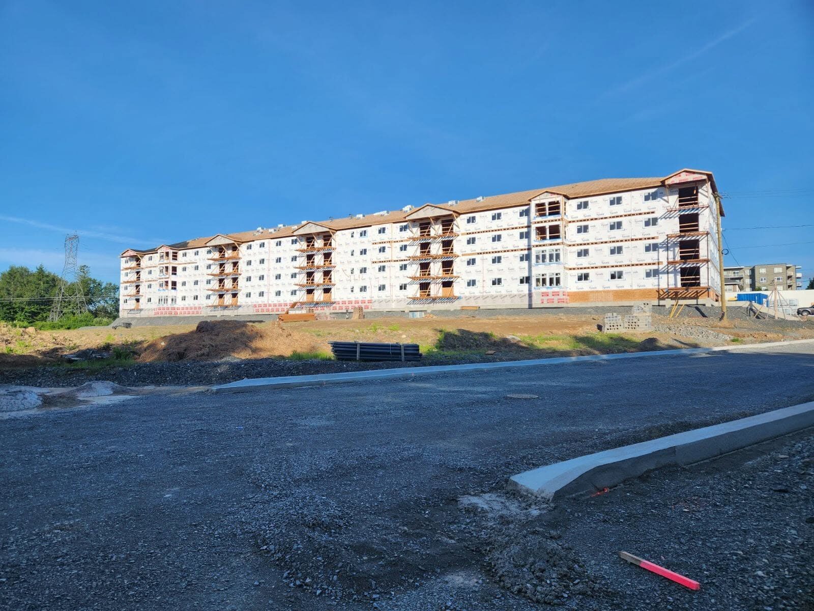 Four-storey framed buildings on Manhattan Drive seen from the new roadway