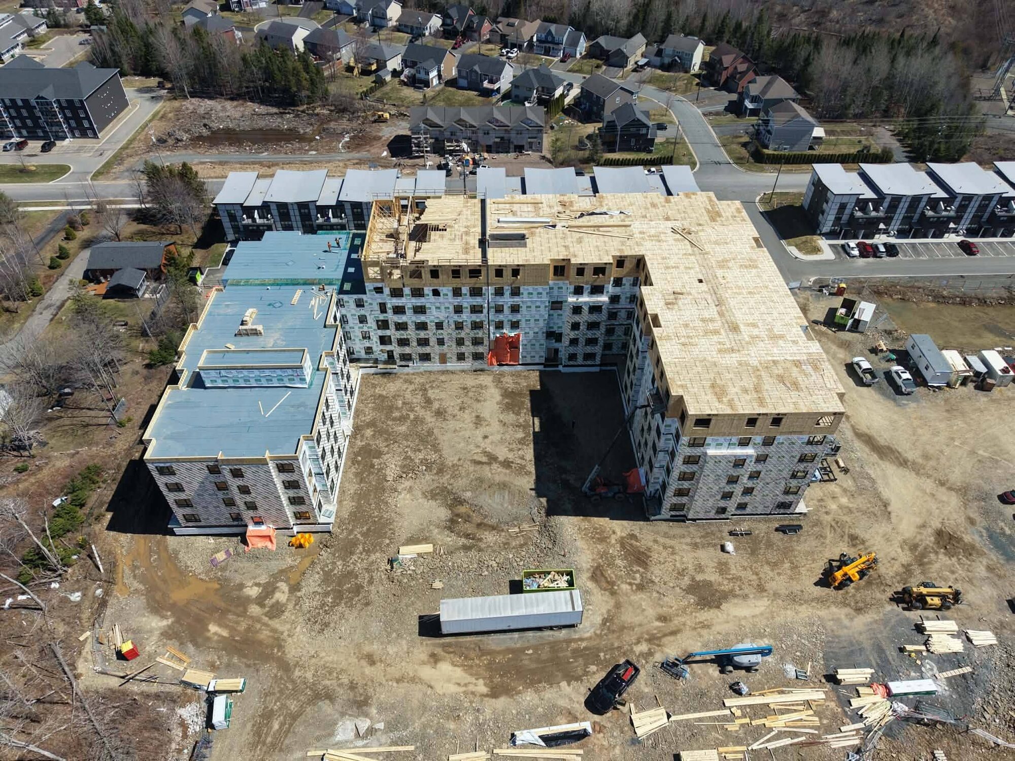 Aerial view of the Serenity Lane apartment complex with the concrete cores in place and framing underway