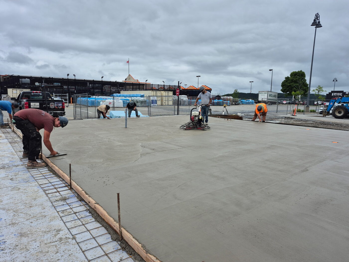 Crew power-floating the fresh slab